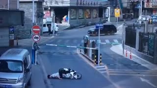 Falling Boom Barrier Knocks Scooter Rider Out Cold