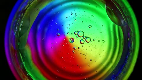 Spinning oily liquid on a glass by stirring