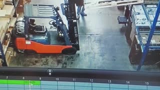 Pallet of TV's Fall onto Forklift Driver