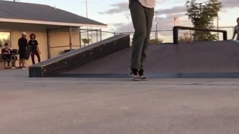 White shirt skateboarder lands hip