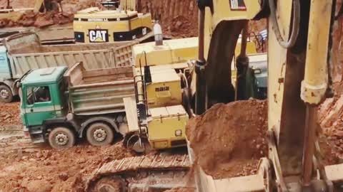 Caterpillar 365C Excavator Loading Trucks