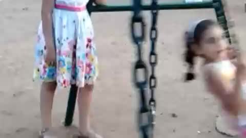 Nesrine and Aya in a playground