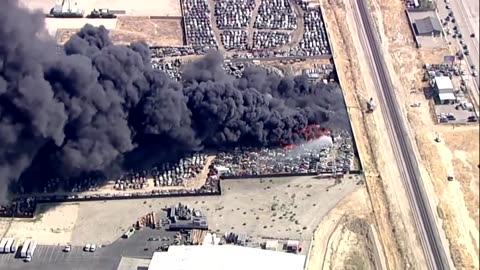 A massive fire breaks out at a California scrap yard