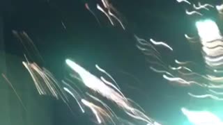 Night time firework explodes on ground level