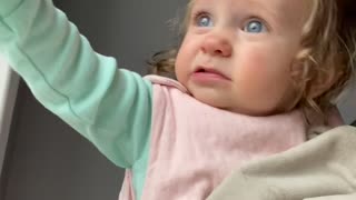Little girl trying to say her first word