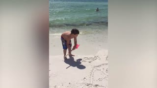 Little Boy Can’t Wait For His Mom To Check Out His Sand Masterpiece