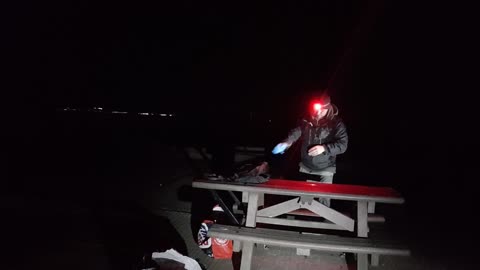 Desconstructing the portable firepit overlooking the solent sea at night 11th Oct.2022