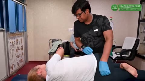 The back pain of a Russian patient will be cured by Chiropractic treatment