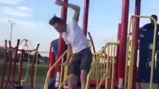 A boy jumps from one playground roof to other