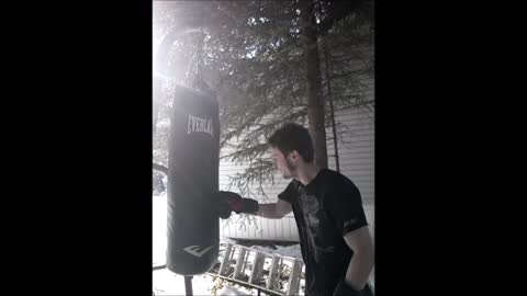 Hitting Frozen Solid Everlast Heavy Bag with 16oz gloves Part 2