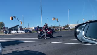 Motorcyclist Runs Red Light and Almost Crashes