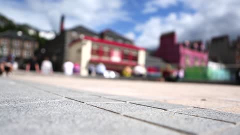 Adorable Blurry Video Of People And Cars Passing In City