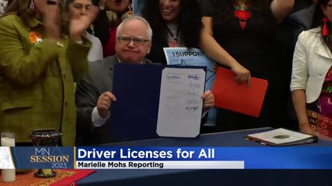 Kamala’s Running mate smiling as he signs a law that provides drivers license for illegals