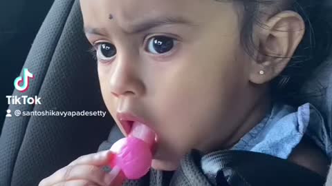 Cute baby eating candy