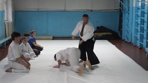 Aikido. New attack defense method. Sensei is showing a new trick.