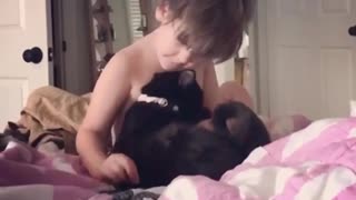 4-year-old boy loves his kitty cat
