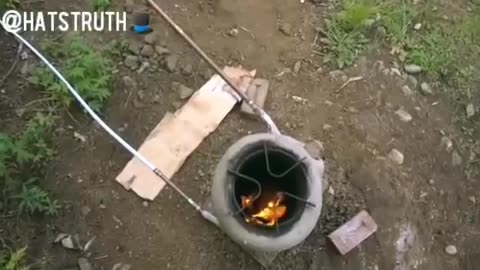 Off Grid Rocket Stove water heater in action