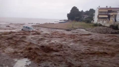 Disastrous flooding in Greece sweeps cars right into the sea