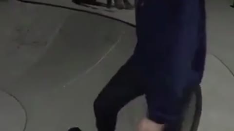 Girl blue sweater skating falls down