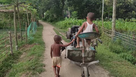 Two small boy vs power tiller driving video |