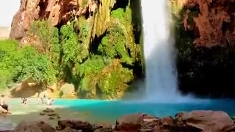 People Chilling At Beautiful waterfall