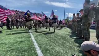 Entire US Army Football Team comes running on field with American flags