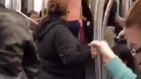 Shirtless guy pole dances in a nyc subway