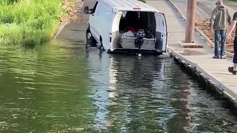 Guy at Boat Dock Loads Boat into His Van