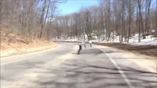 Snow longboard bail hits filmer