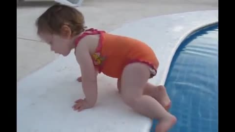 Funny baby trying to swim