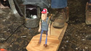 Crazy Morons Play music while dancing wooden doll with foot