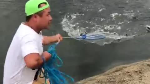 Fishing by net in small river