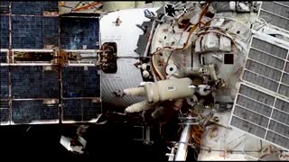 Russian Cosmonauts perform a spacewalk