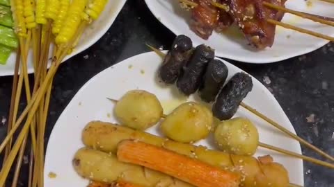 skewered food served in hot pot