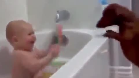 baby laughs in the bathroom