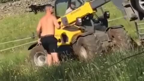 Farmer loses is mind and removes car off his farm with machine