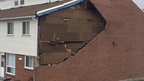 Wind Rips Down Brick Wall