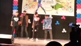 4 guys perform closer and once direction song on stage