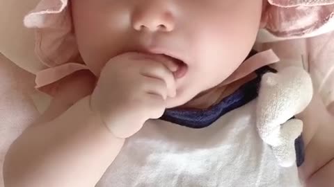 Cute baby thirsty milk.