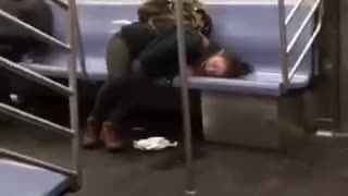 Woman passed out drunk on a subway train,