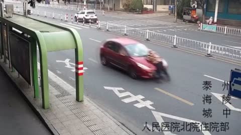 Woman Drives Off With Dad On Car Bonnet