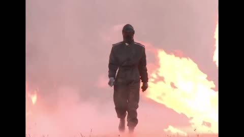 Woman Tests Her Russian Combat Suit By Walking Through Explosions!