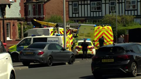 Chilling moment hooded and masked figure paces outside house 20 minutes before two children were