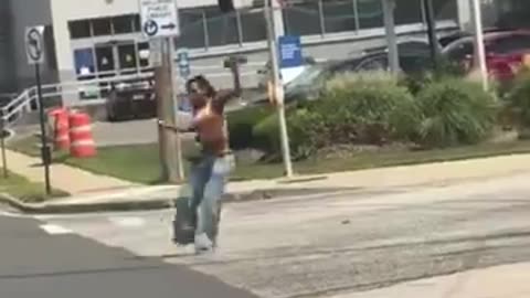 WOMAN WALKING AROUND THE STREETS OF NEW YORK POINTING A GUN AT EVERYONE GETS TAKEN OUT. GUESS WHO?