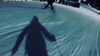 Two skiers bush jump