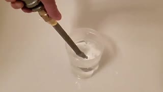 Releasing compressed air into water. Slow motion