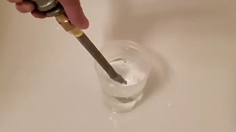 Releasing compressed air into water. Slow motion