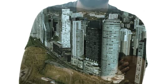 A person crossing his arms and a city with tall buildings