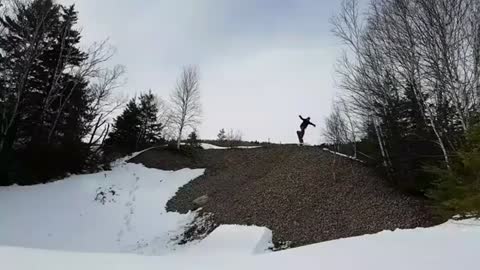 Snowboarder Goes for Huge Jump and Fails