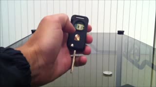 How to change the remote control key battery on a Porsche Cayenne S.